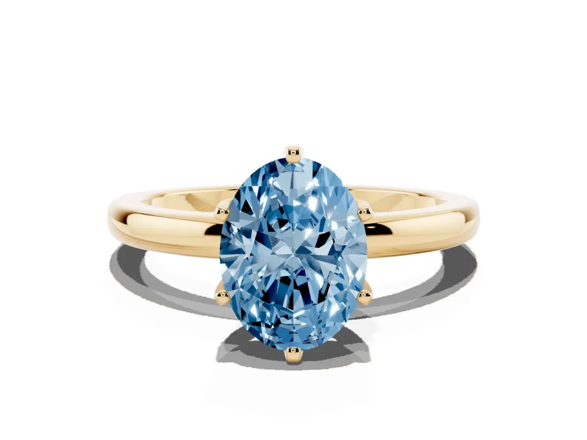 Fancy Blue Oval Cut Solitaire Diamond Ring with Six-Prong Setting on a Classic Band Yellow gold