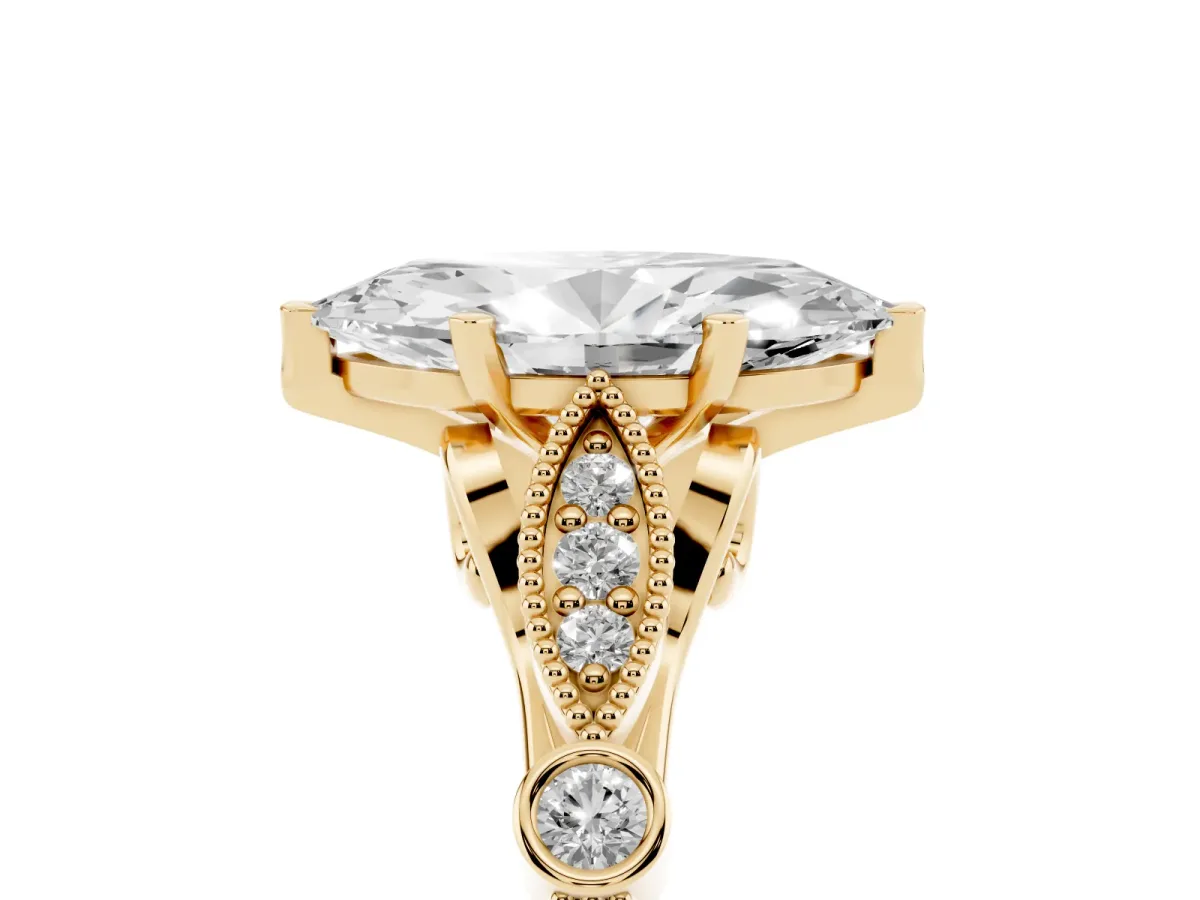 Marquise Cut Cut Diamond with Milgrain Marquise and Bezel Accents on a Solitaire Band with Prong Setting Yellow gold