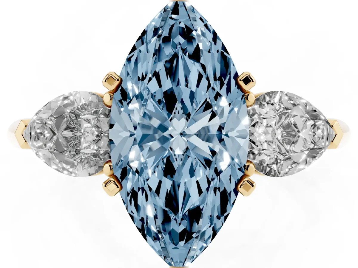 Fancy Blue Three-Stone Marquise Cut Diamond Ring with Pear Side Stones and Four-Prong Setting Yellow gold