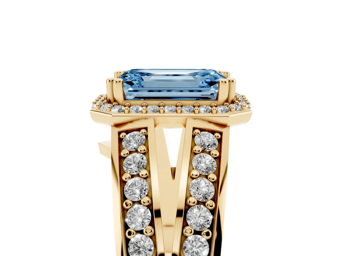 Fancy Blue Emerald Cut Diamond Halo Ring with Split Shank Pavé Band and Four-Prong Setting Yellow gold