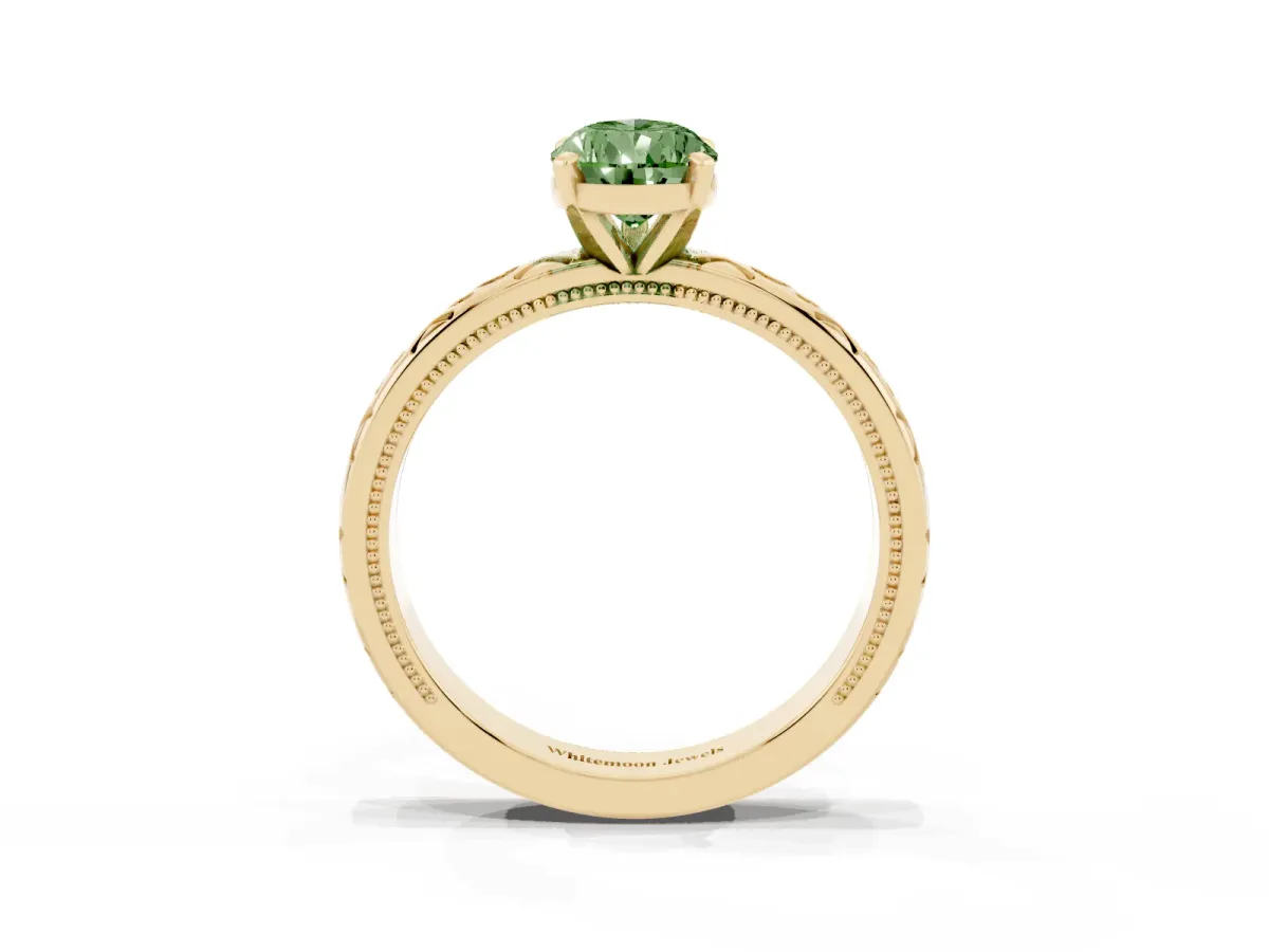 Fancy Green Pear Cut Solitaire Engagement Ring with Scrollwork Band and Four-Prong Setting Yellow gold