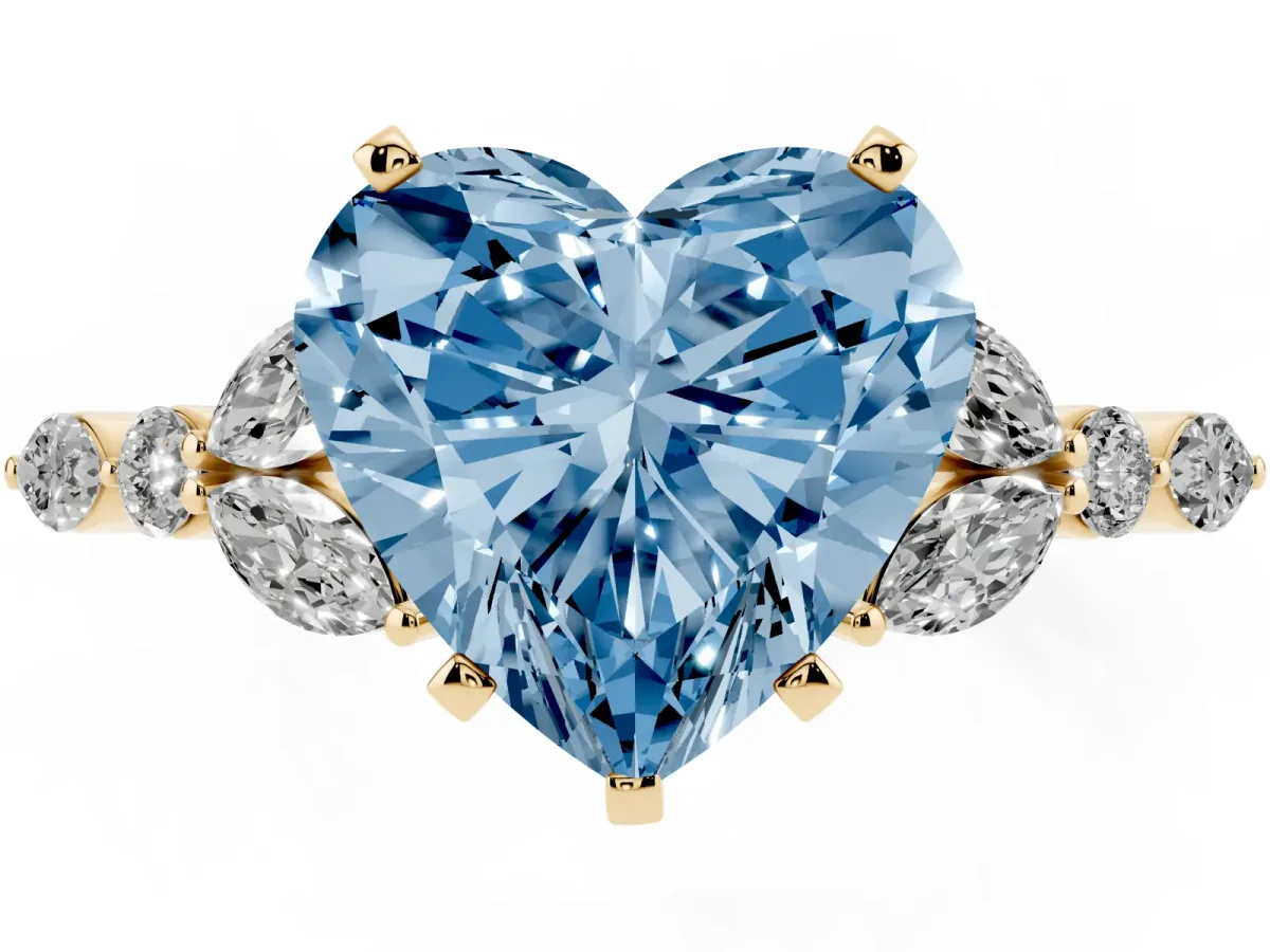 Fancy Blue Heart Cut Diamond Solitaire Ring with Side Stones and Four-Prong Setting Yellow gold