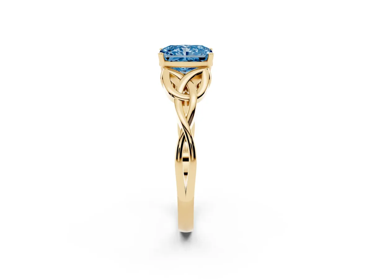 Fancy Blue Radiant Cut Diamond Solitaire Engagement Ring with Celtic Knot Band and Four-Prong Setting Yellow gold