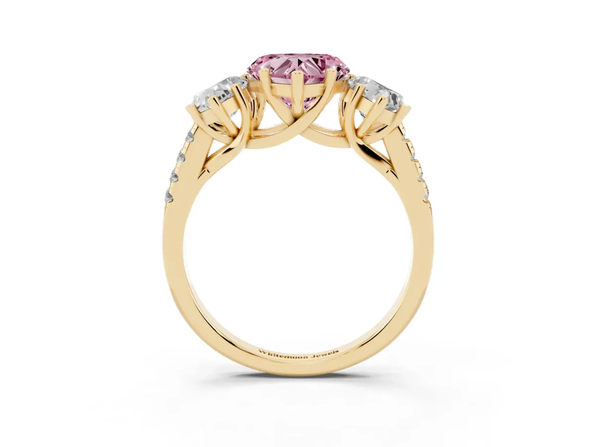 Fancy Pink Three-Stone Heart Cut Diamond Ring with Round Pavé Band and Prong Setting Yellow gold