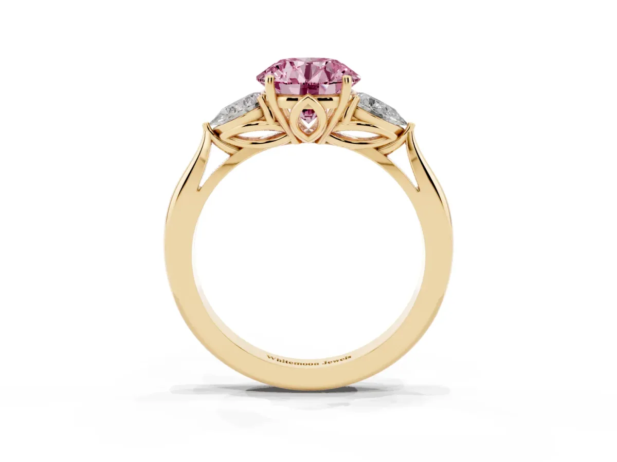 Fancy Pink Three-Stone Round Cut Diamond Ring with Pear Side Stones in Four-Prong Setting Yellow gold