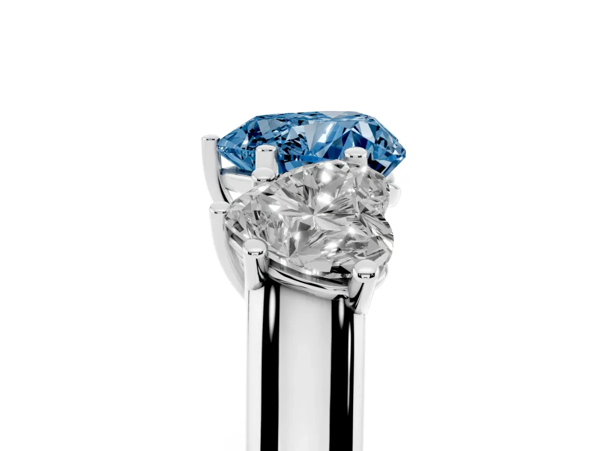 Fancy Blue Heart Cut Three-Stone Diamond Ring with Prong Setting on a Classic Band Platinum