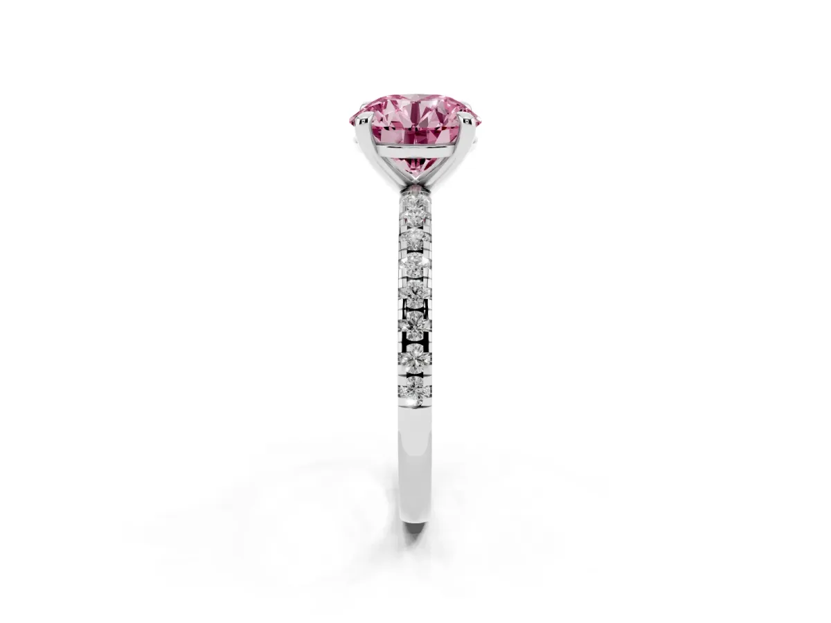 Fancy Pink Round Cut Diamond Brilliant Solitaire Ring with Pavé Band and Four-Prong Setting Silver