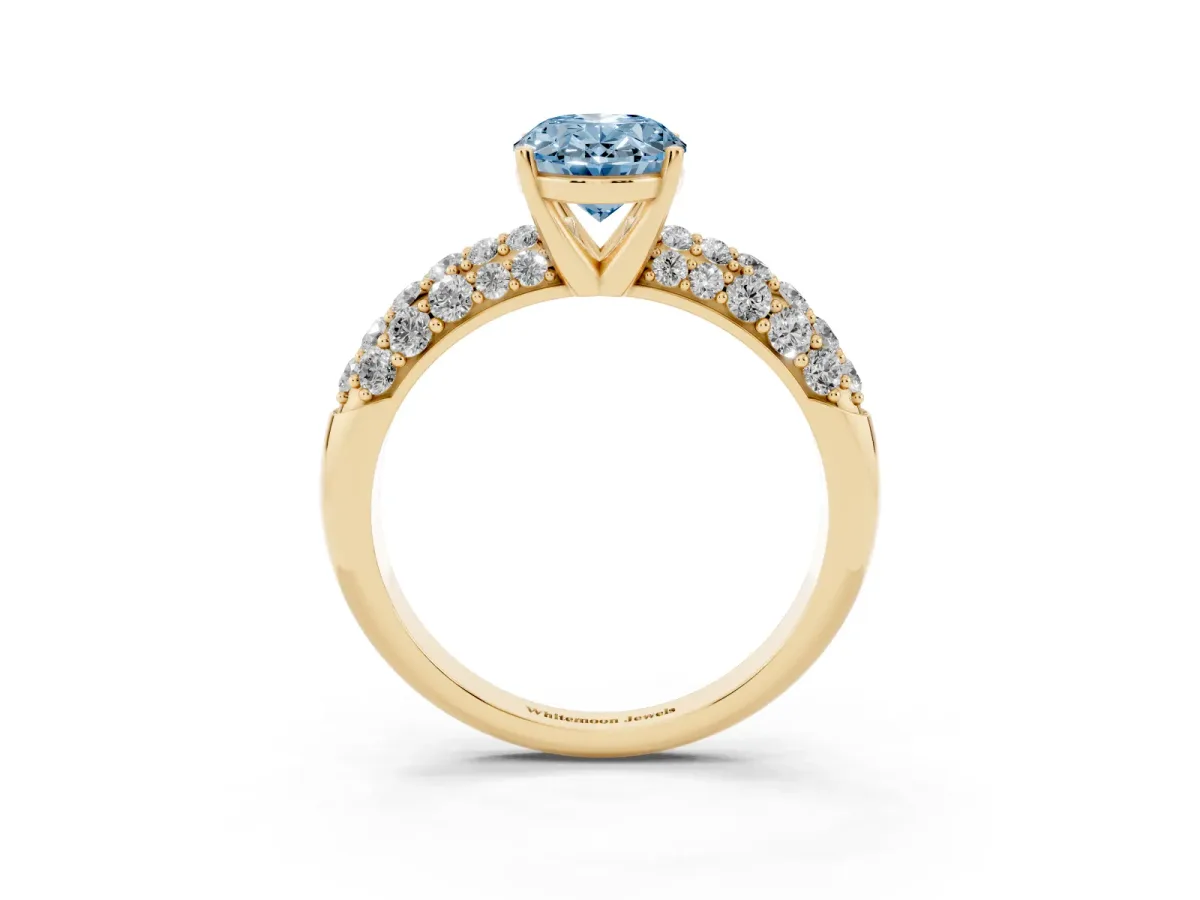 Fancy Blue Oval Cut Diamond Pavé Band Solitaire Ring with Four-Prong Setting Yellow gold