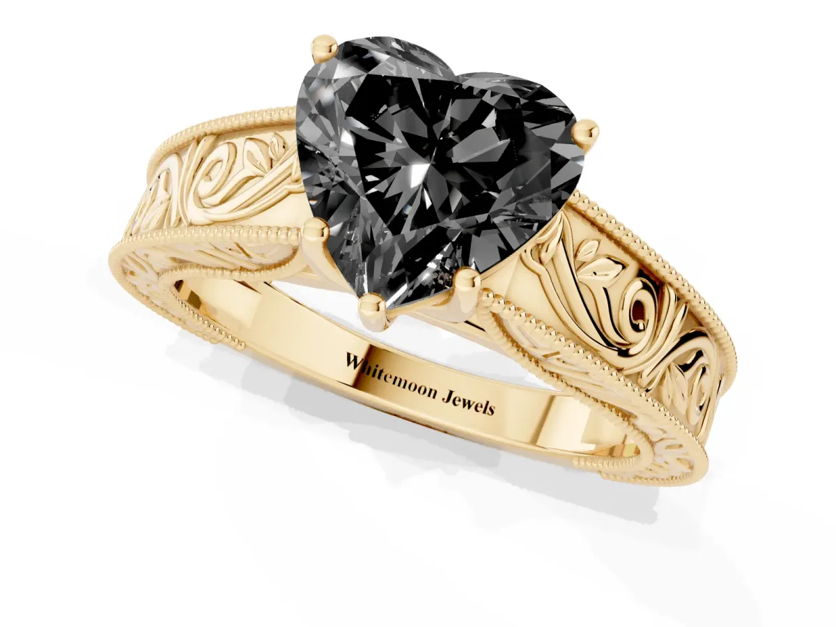 Fancy Black Heart Cut Diamond Solitaire Ring with Engraved Band and Four-Prong Setting Yellow gold