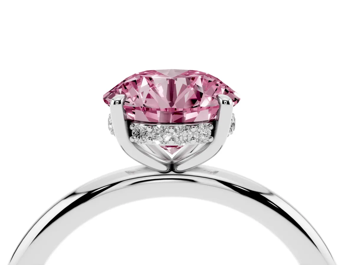 Fancy Pink Round Cut Diamond Solitaire Ring with Thin Band and Four-Prong Setting Silver
