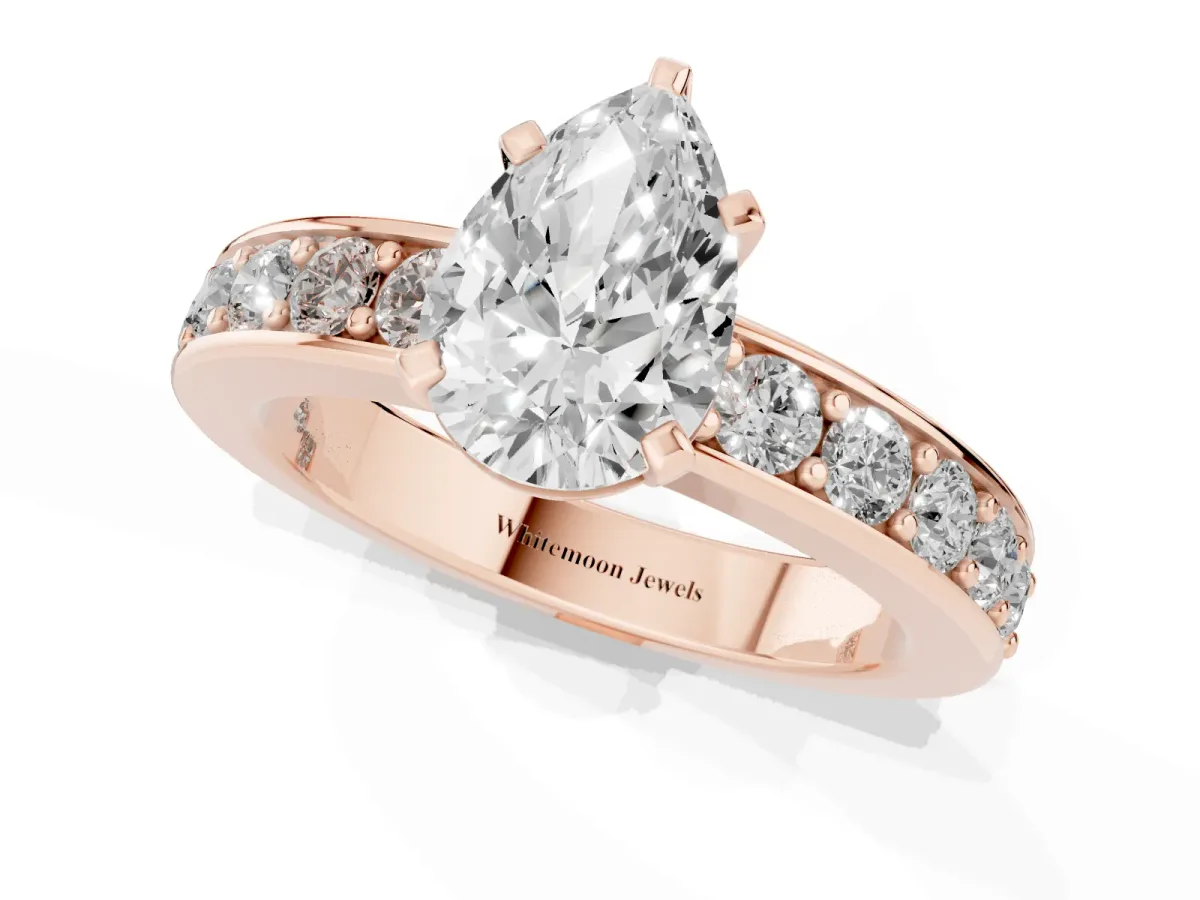 Pear Cut Diamond Engagement Ring with Channel Set Round Band and Prong Setting Rose gold
