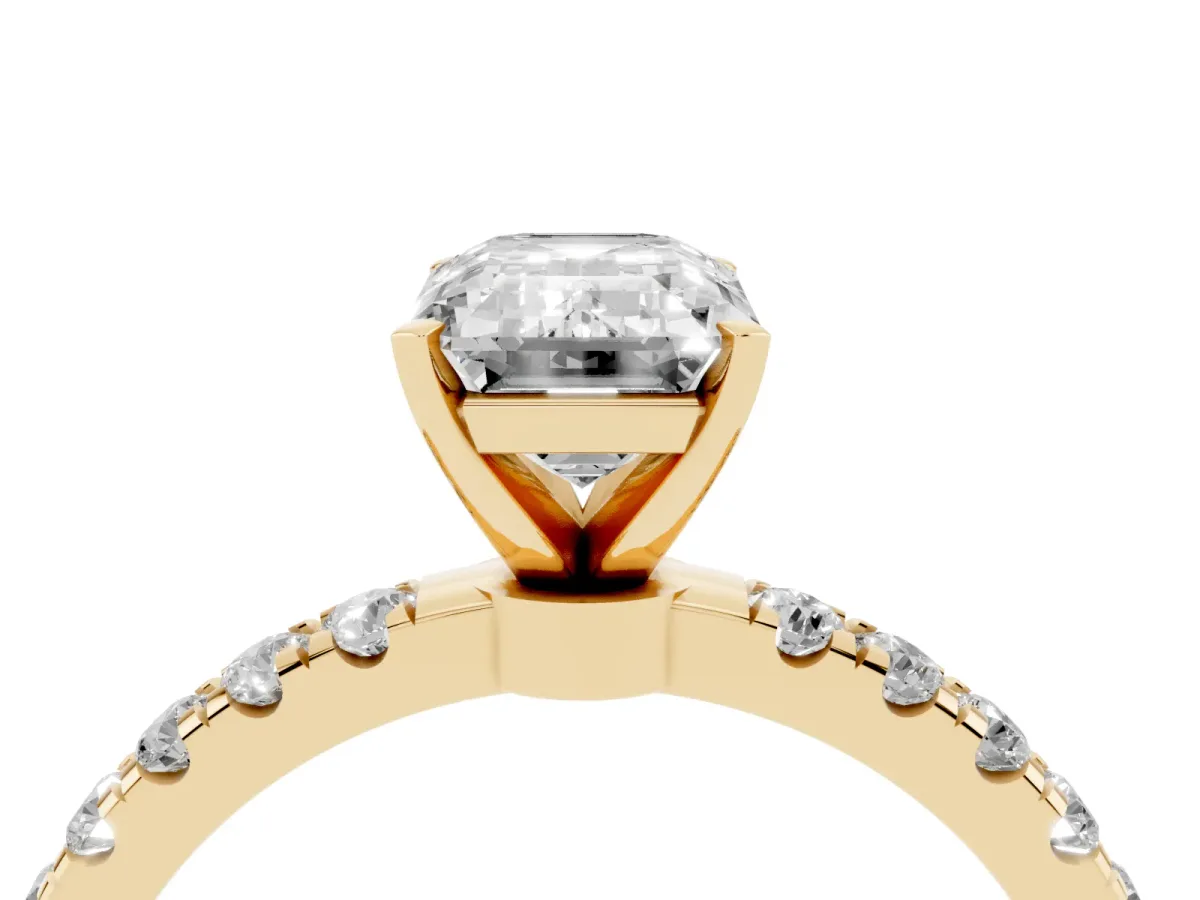 Emerald Cut Diamond Solitaire Ring with Pavé Accents and Four-Prong Setting Yellow gold