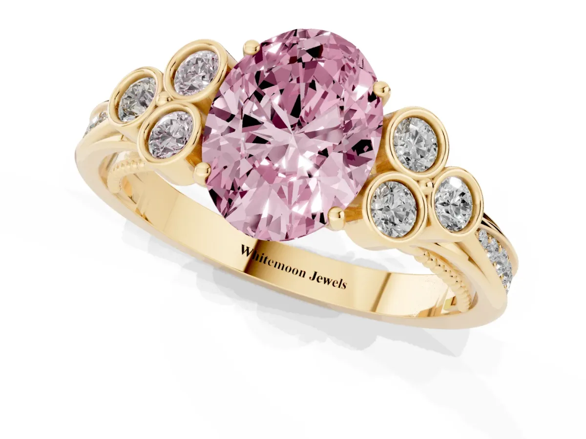 Fancy Pink Oval Cut Cut Diamond Engagement Ring with Bezel Set Round Side Stones and Prong Setting Yellow gold