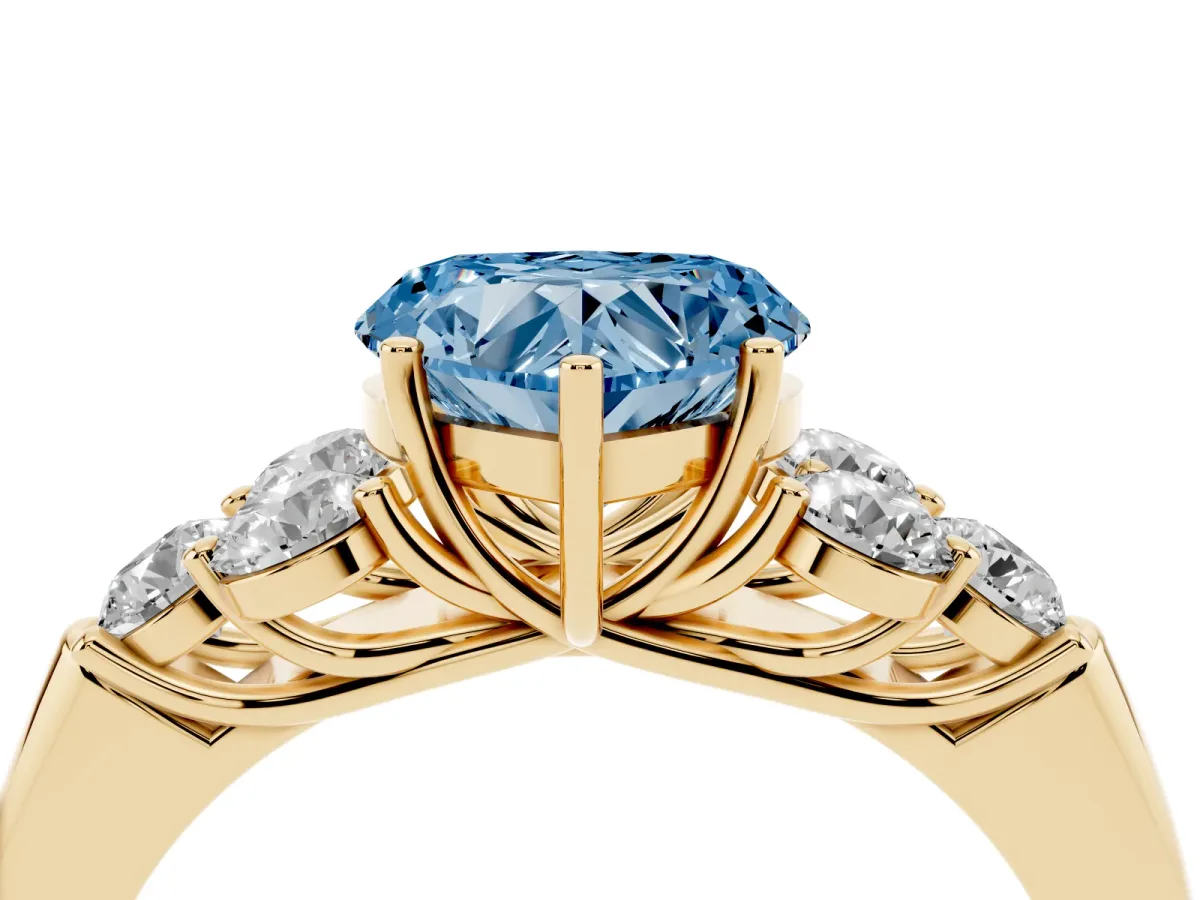Fancy Blue Heart Cut Cut Diamond Cluster Ring with Round Accent Stones and Prong Setting on a Classic Band Yellow gold