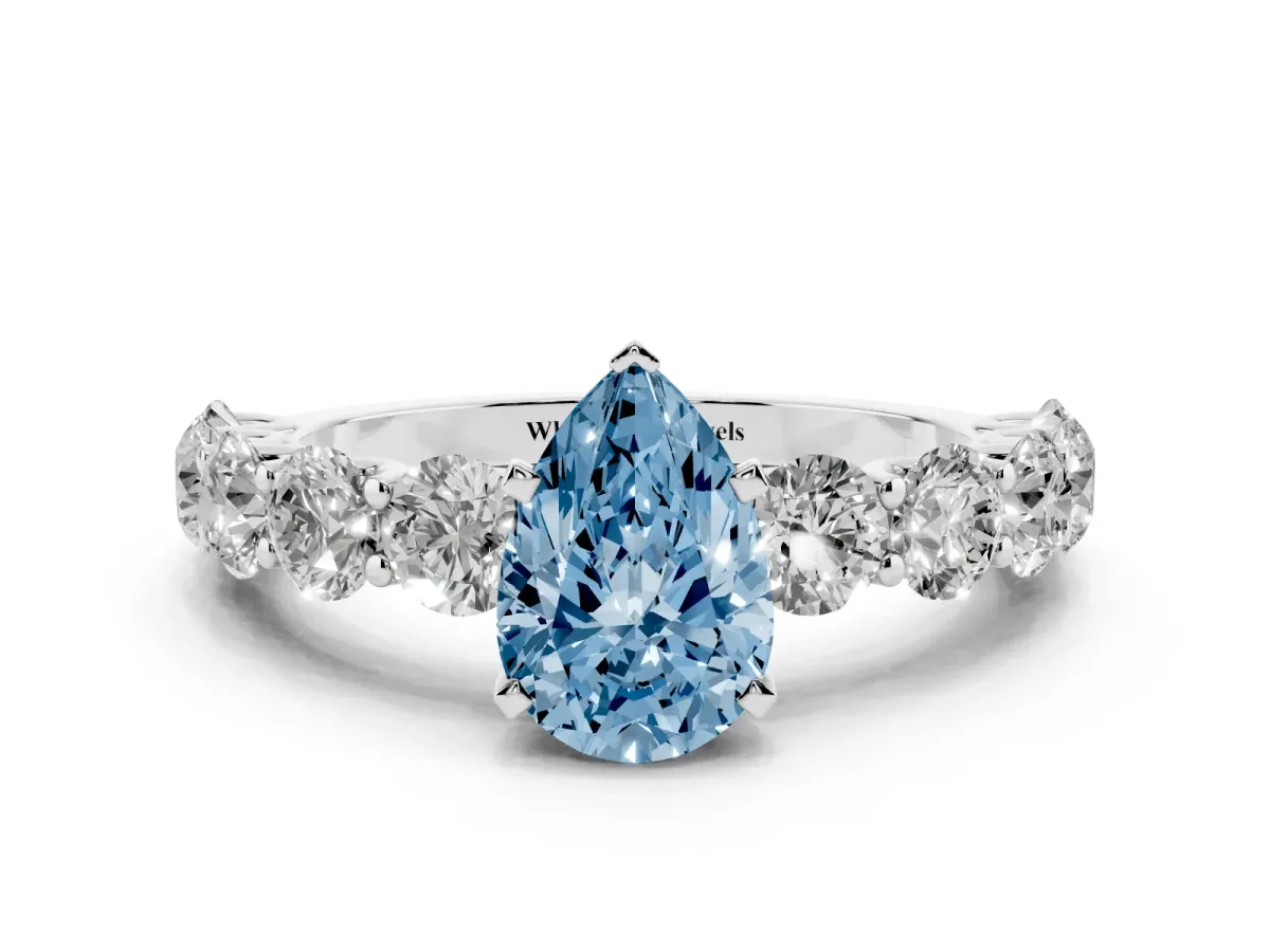 Fancy Blue Pear Cut Diamond Prong Setting with Side Stones on a Pave Band Platinum
