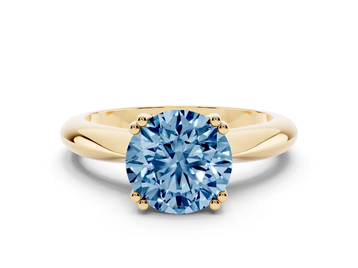 Fancy Blue Round Cut Cut Solitaire Engagement Ring with Tapered Band and Four-Prong Setting Yellow gold
