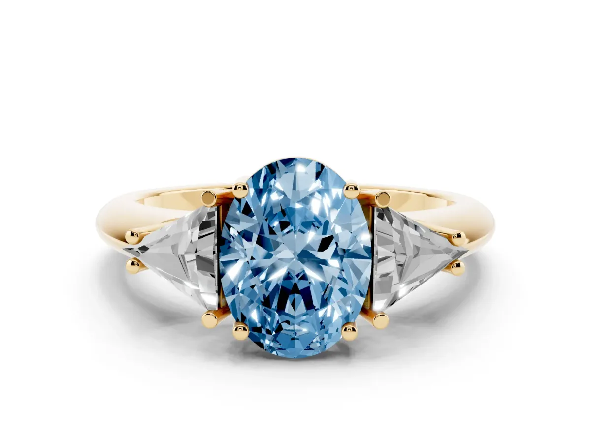 Fancy Blue Three-Stone Oval Cut Diamond Engagement Ring with Trillion Side Stones and Prong Setting Yellow gold