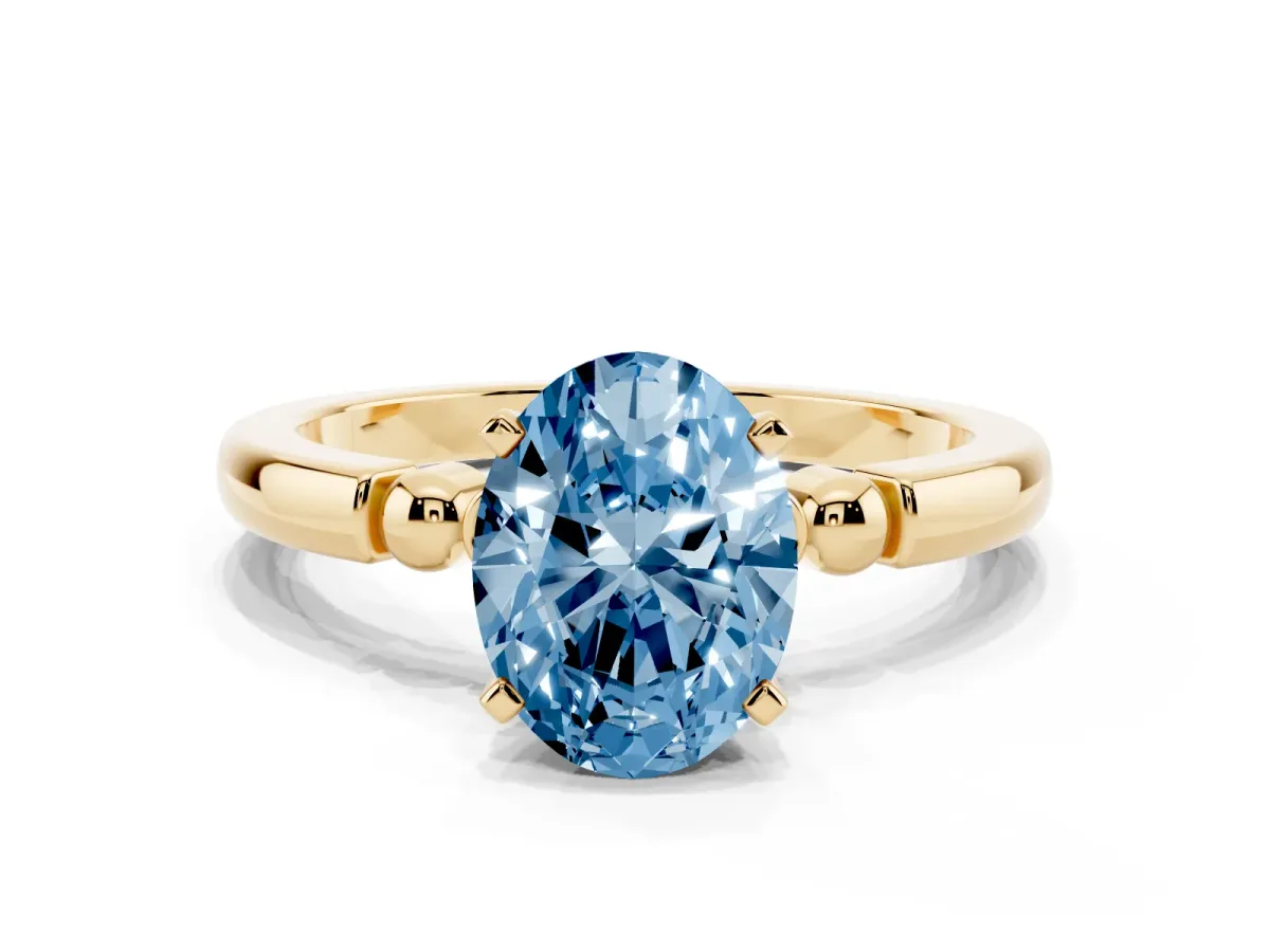 Fancy Blue Oval Cut Solitaire Beaded Band with Four-Prong Setting Yellow gold