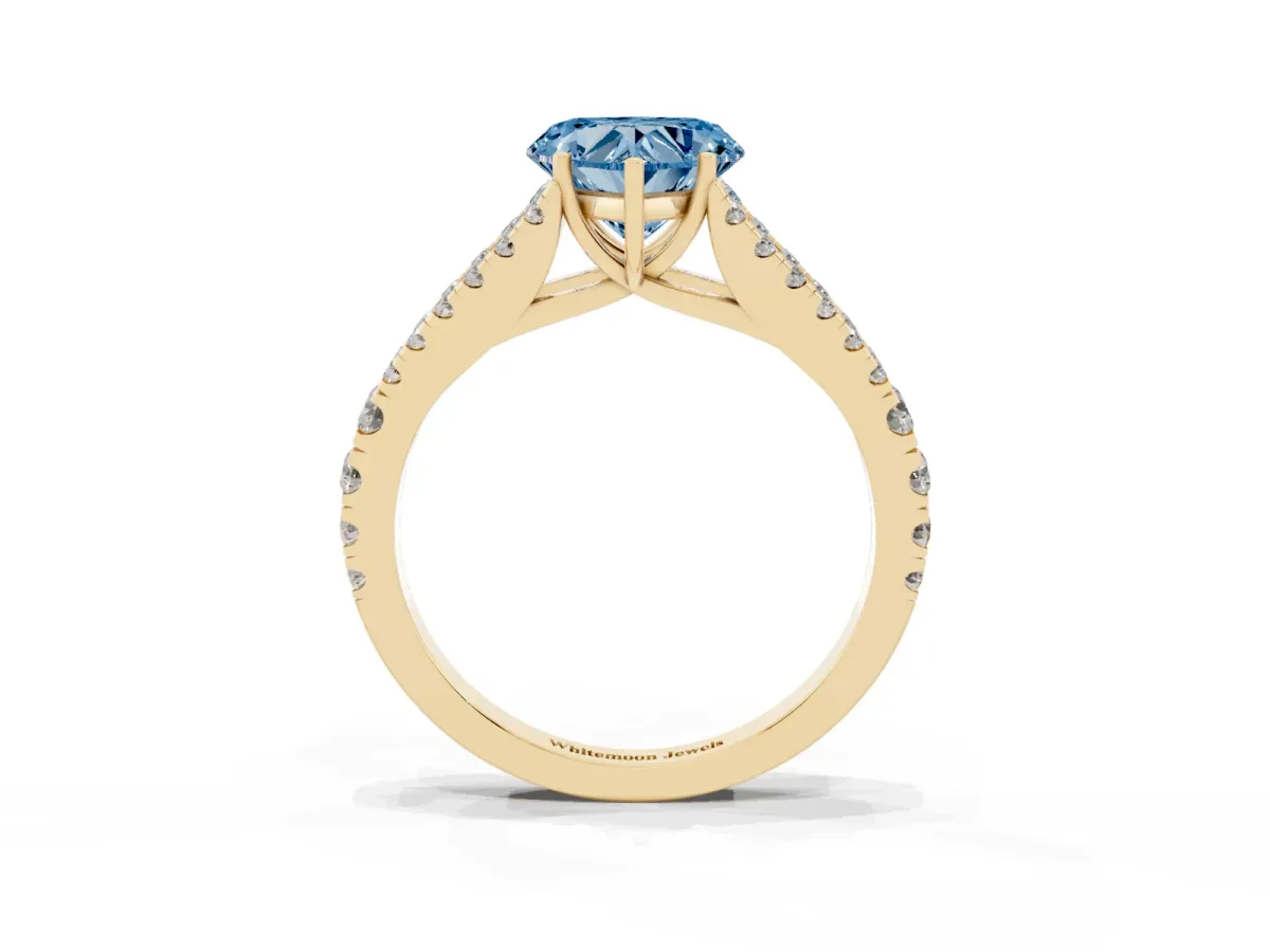 Fancy Blue Heart Cut Diamond Split Shank Engagement Ring with Round Pavé and Prong Setting Yellow gold