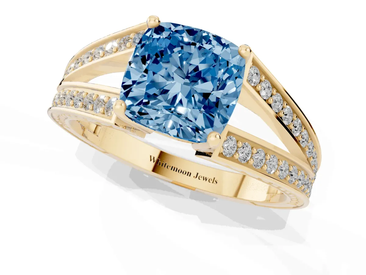 Fancy Blue Cushion Cut Diamond Split Shank Ring with Pavé Band and Four-Prong Setting Yellow gold