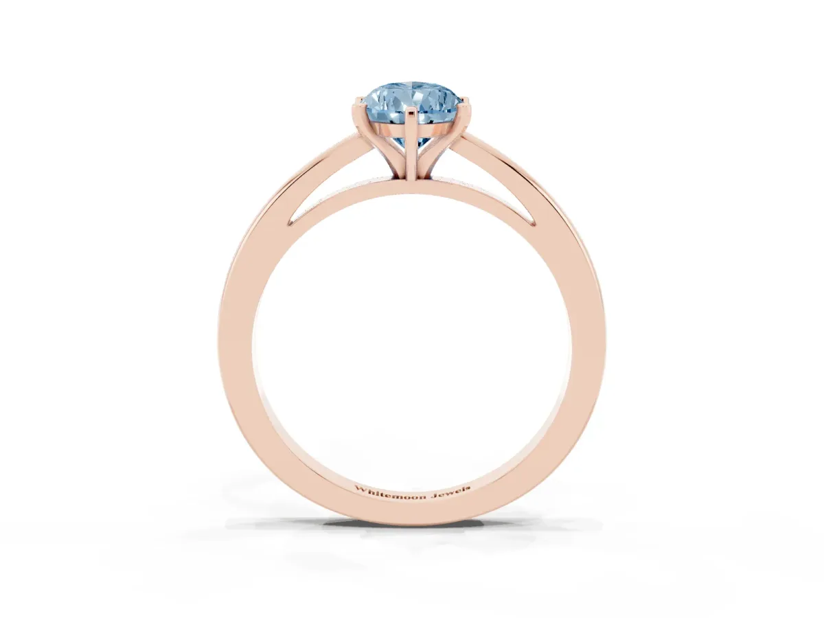 Fancy Blue Pear Cut Solitaire Diamond Engagement Ring with Four-Prong Setting on a Classic Band Rose gold