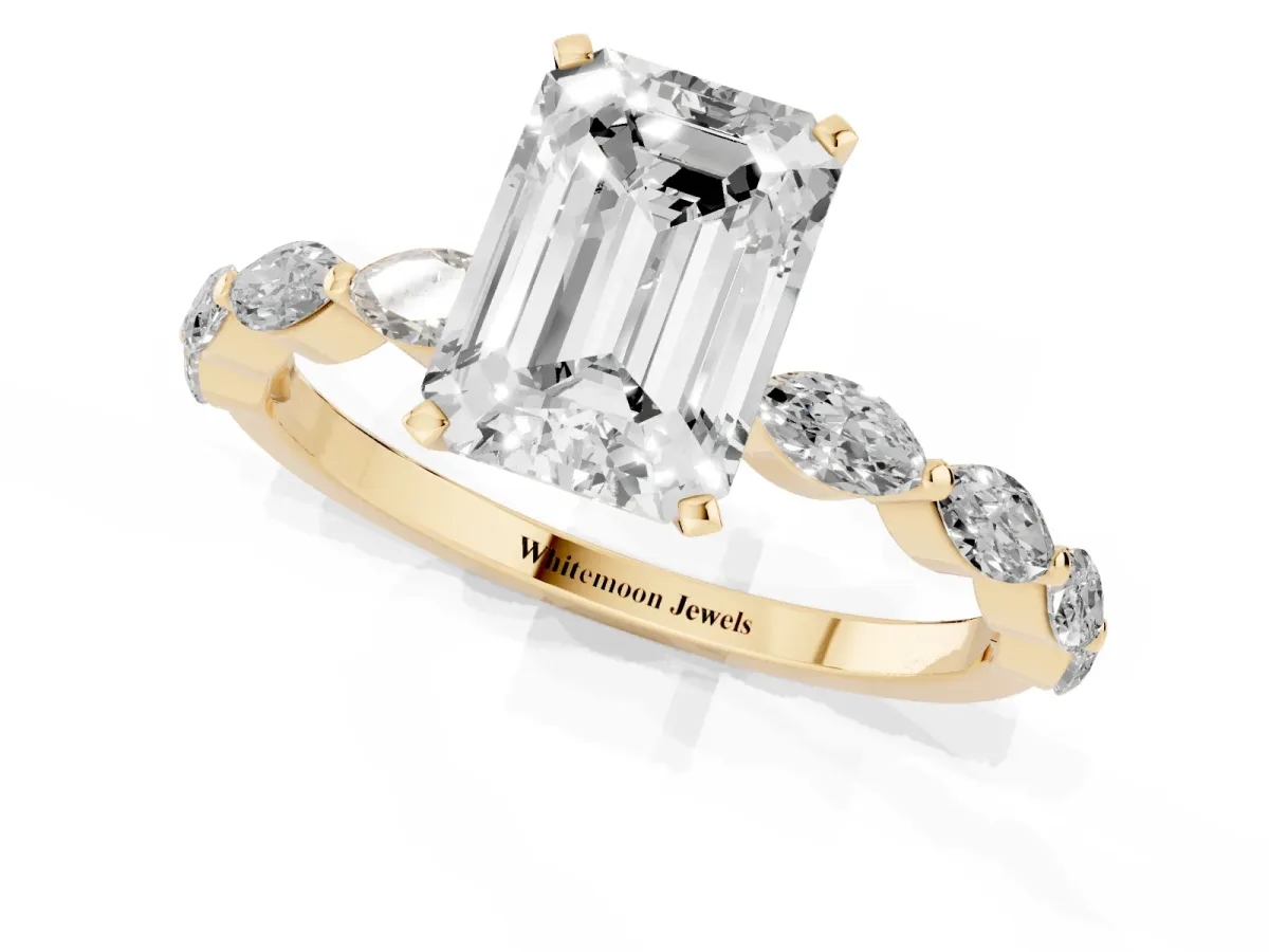 Emerald Cut Diamond Ring with Marquise Side Stones and Prong Setting Yellow gold