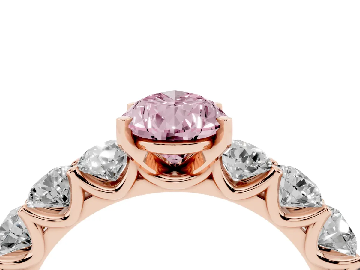 Fancy Pink Pear Cut Diamond Prong Setting with Side Stones on a Pave Band Rose gold