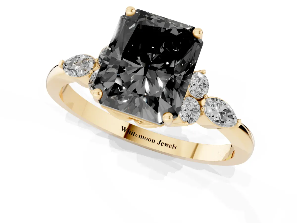 Fancy Black Radiant Cut Brilliant Diamond Solitaire Ring with Pear Side Stones and Four-Prong Setting Yellow gold