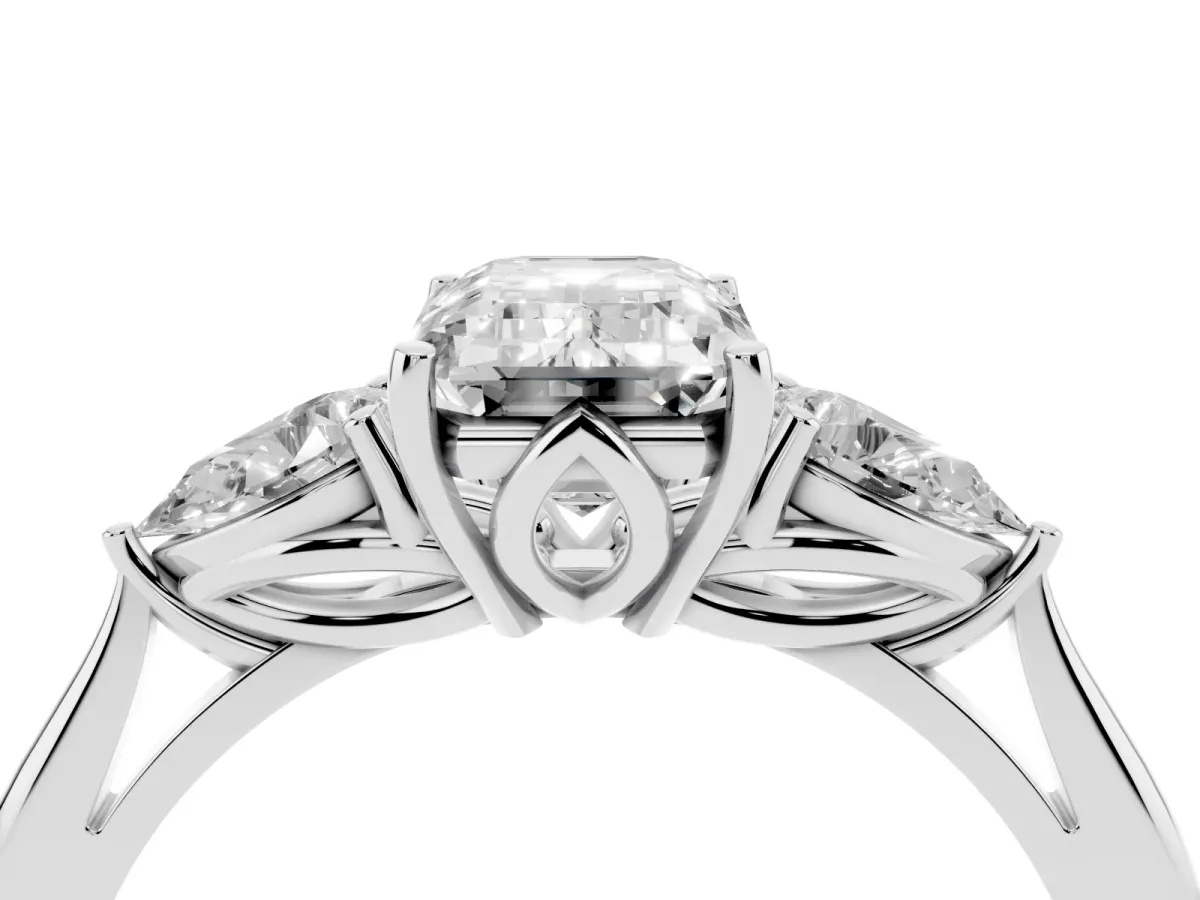 Three-Stone Emerald Cut Diamond Ring with Pear Side Stones in Four-Prong Setting Platinum