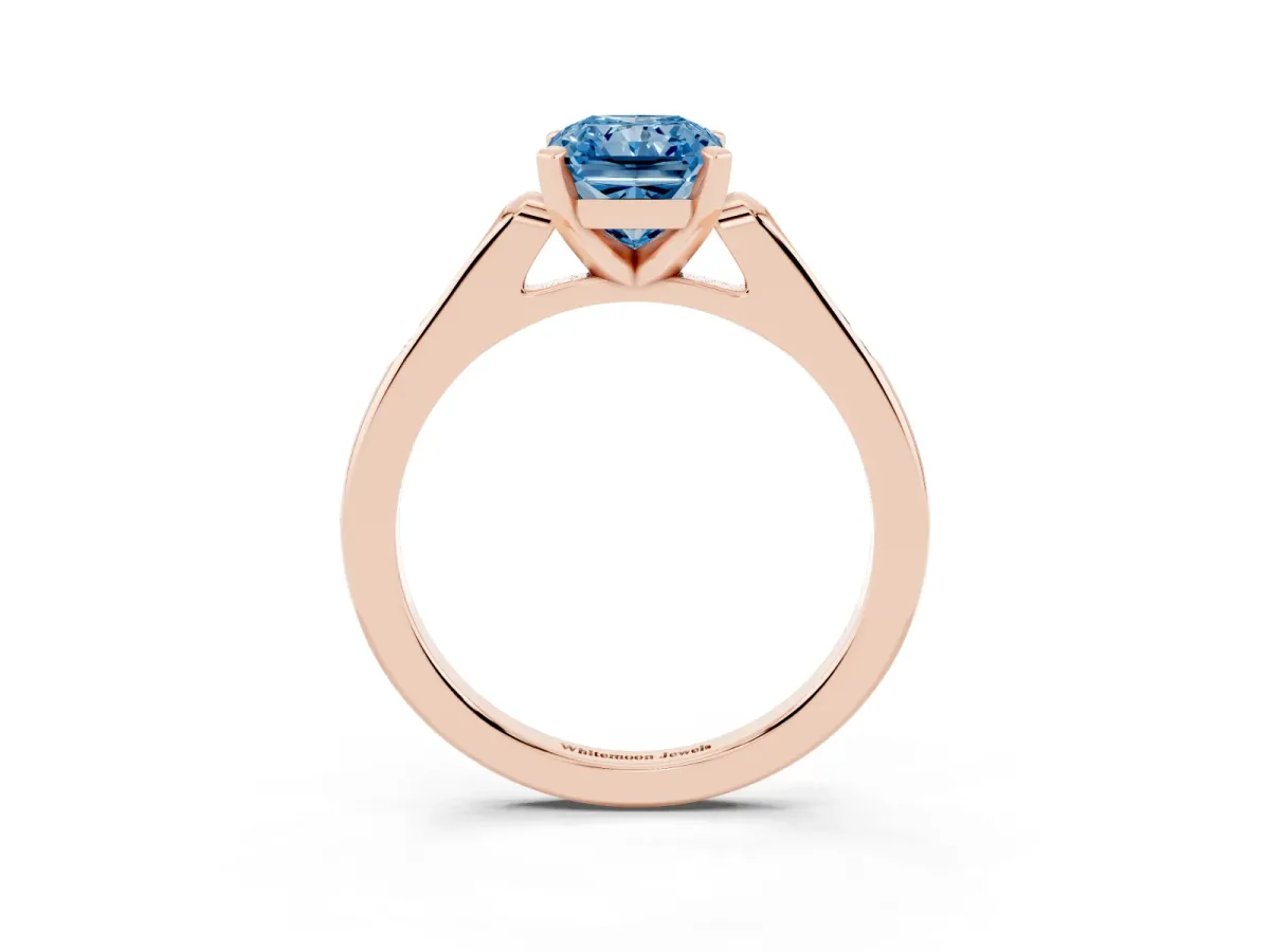 Fancy Blue Radiant Cut Diamond Solitaire Ring with Channel Set Round Band and Prong Setting Rose gold