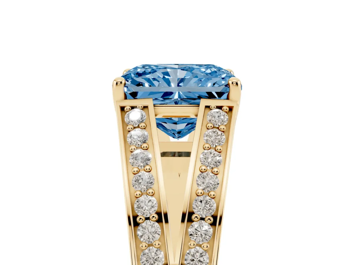 Fancy Blue Radiant Cut Diamond Split Shank Ring with Pavé Band and Four-Prong Setting Yellow gold