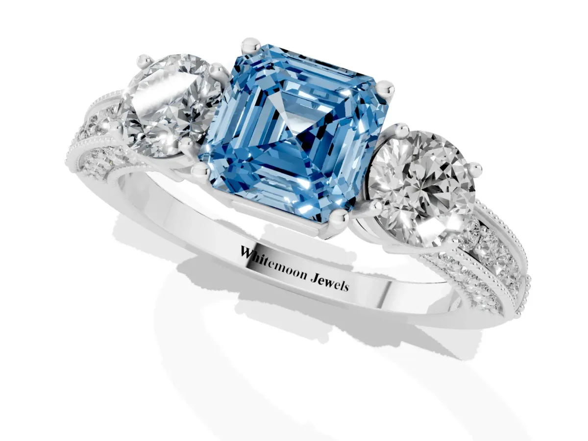 Fancy Blue Asscher Cut Three-Stone Diamond Ring with Pavé Band and Four-Prong Setting Silver
