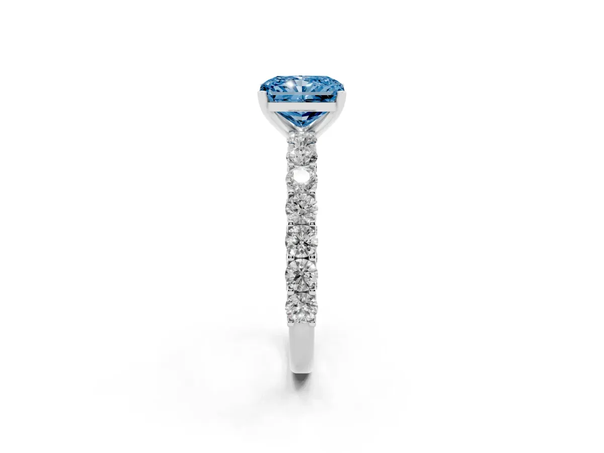 Fancy Blue Radiant Cut Diamond Solitaire Ring with Shared Prong Pavé Band and Four-Prong Setting Silver