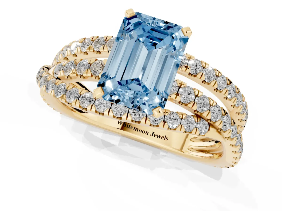 Fancy Blue Emerald Cut Solitaire Twist Band with Pavé Setting and Four-Prong Setting Yellow gold