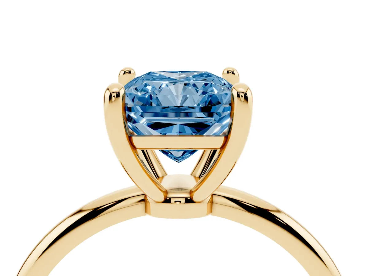 Fancy Blue Radiant Cut Solitaire Diamond Ring with 4-Prong Setting on a Classic Band Yellow gold