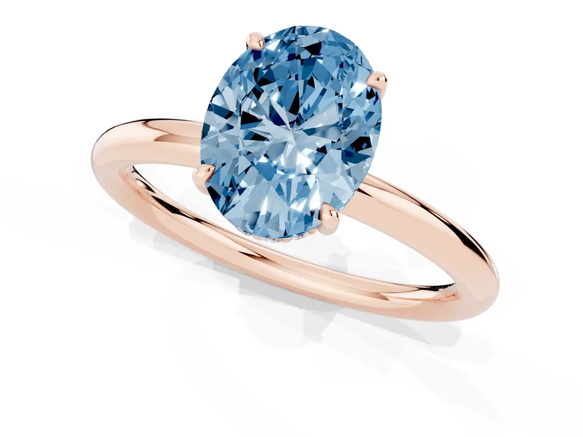 Fancy Blue Oval Cut Diamond Solitaire Ring with Thin Band and Four-Prong Setting Rose gold