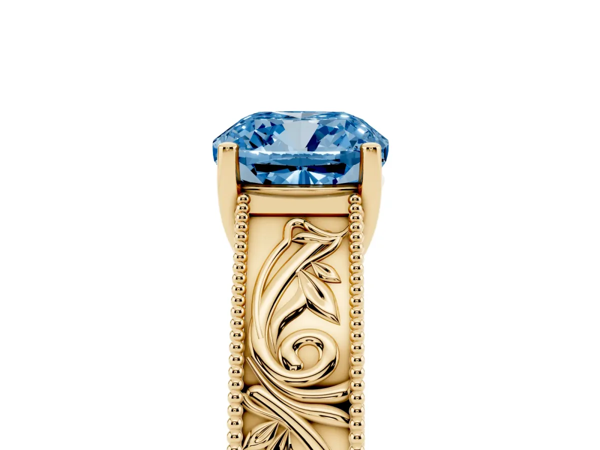Fancy Blue Cushion Cut Diamond Solitaire Ring with Engraved Band and Four-Prong Setting Yellow gold