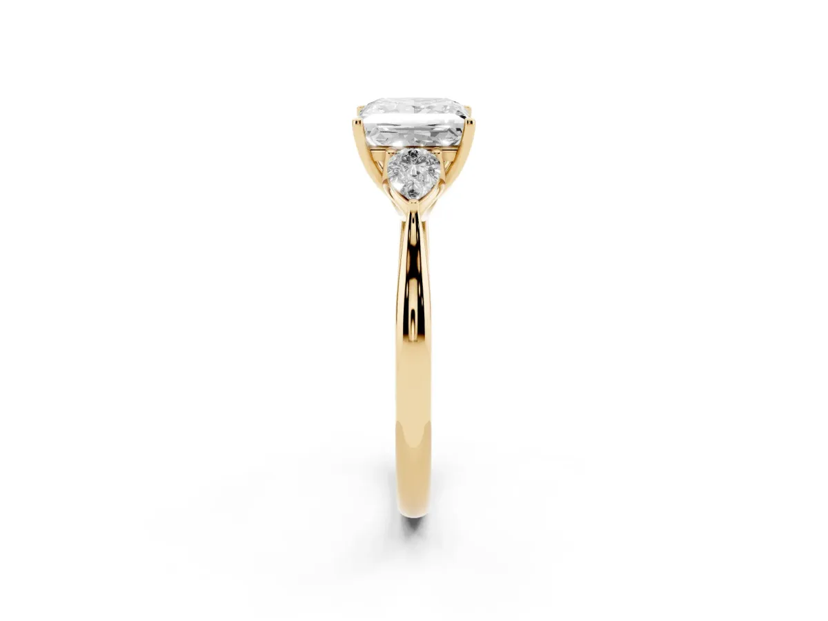 Three-Stone Princess Cut Diamond Ring with Pear Side Stones in Four-Prong Setting Yellow gold
