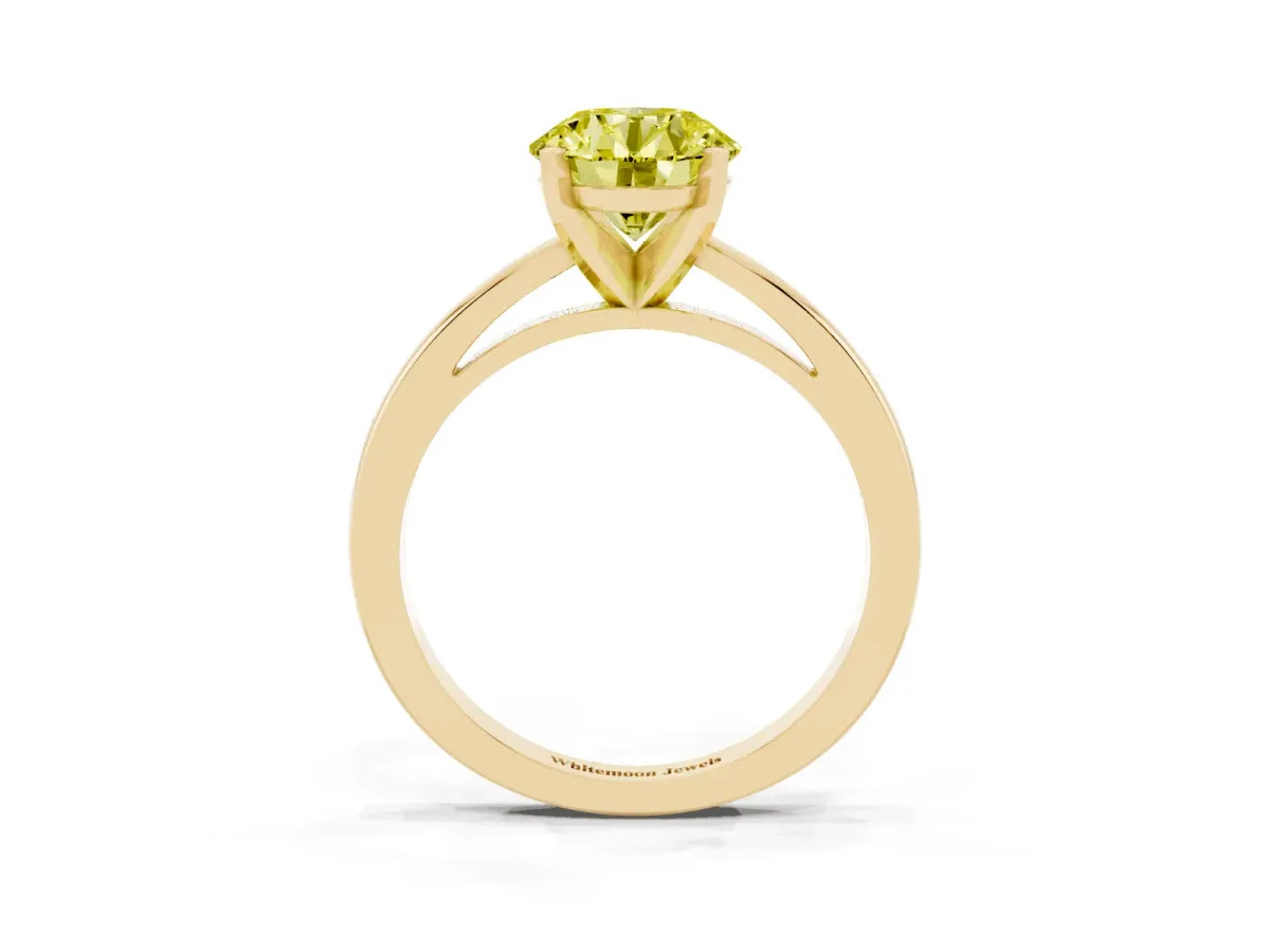 Fancy Yellow Round Cut Solitaire Diamond Engagement Ring with Four-Prong Setting on a Classic Band Yellow gold
