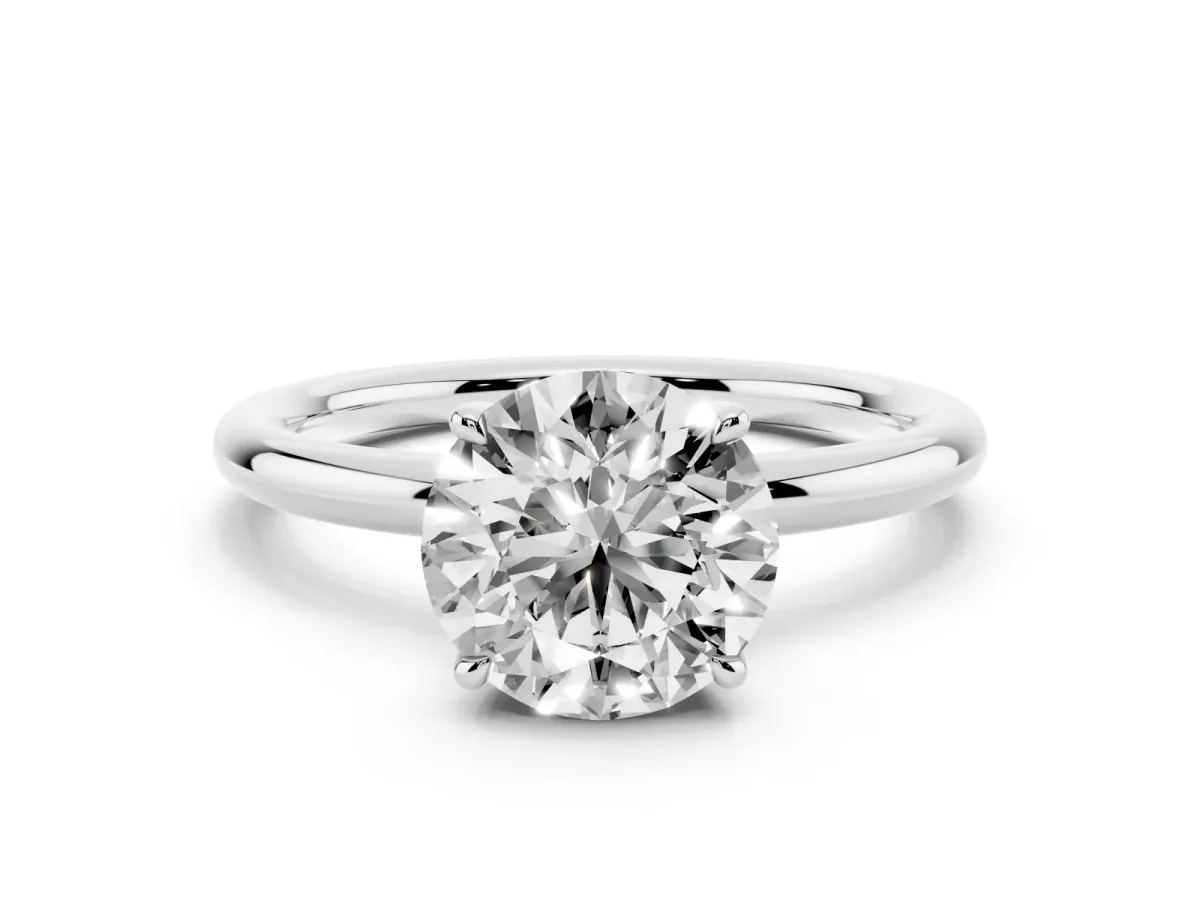 Round Cut Diamond Solitaire Ring with Thin Band and Four-Prong Setting Silver