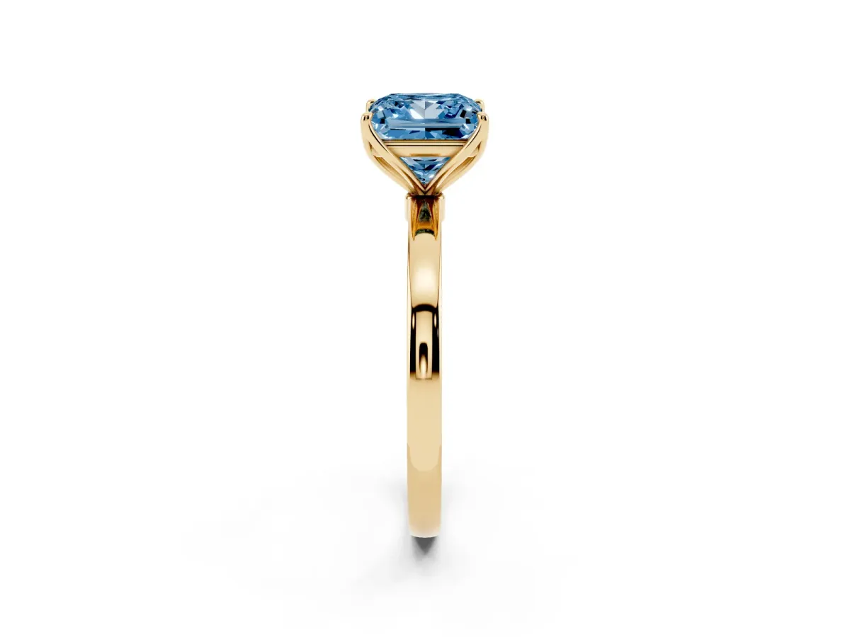 Fancy Blue Princess Cut Diamond Solitaire Ring with Thin Band and Prong Setting Yellow gold
