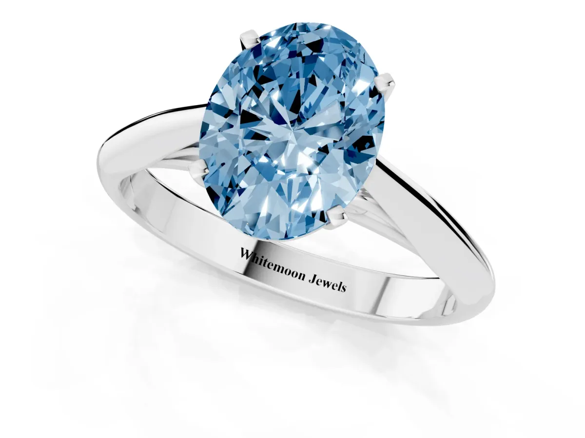 Fancy Blue Oval Cut Diamond Solitaire Engagement Ring with Cathedral Setting and Four-Prong Mount Silver