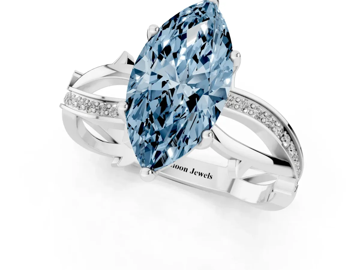 Fancy Blue Marquise Cut Solitaire Twist Band with Pavé Accents and Four-Prong Setting Silver