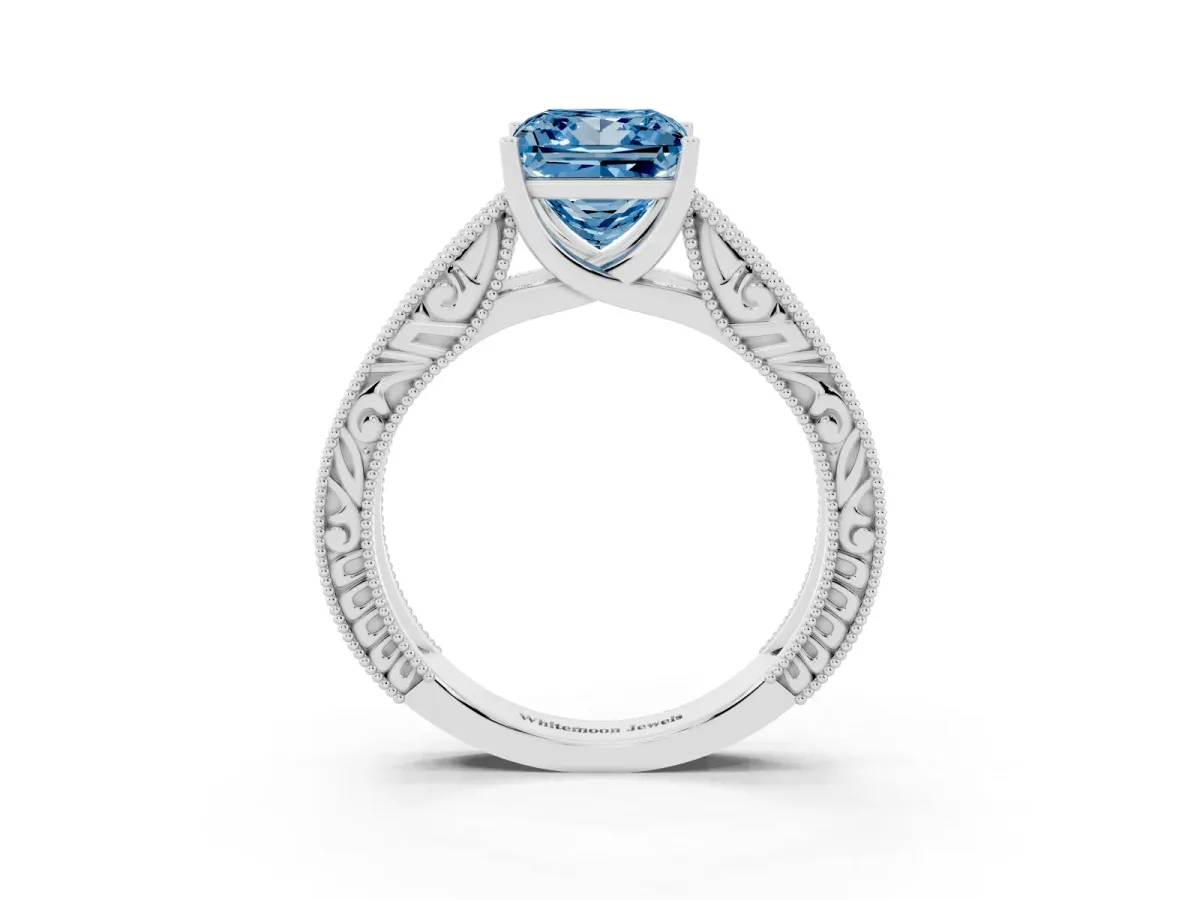 Fancy Blue Princess Cut Diamond Solitaire Ring with Engraved Band and Four-Prong Setting White gold