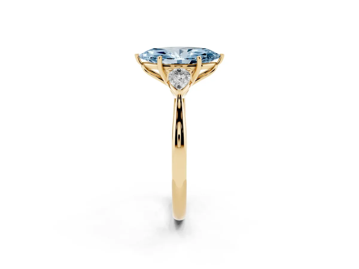 Fancy Blue Marquise Cut Diamond Three-Stone Ring with Pear Side Stones and Prong Setting Yellow gold