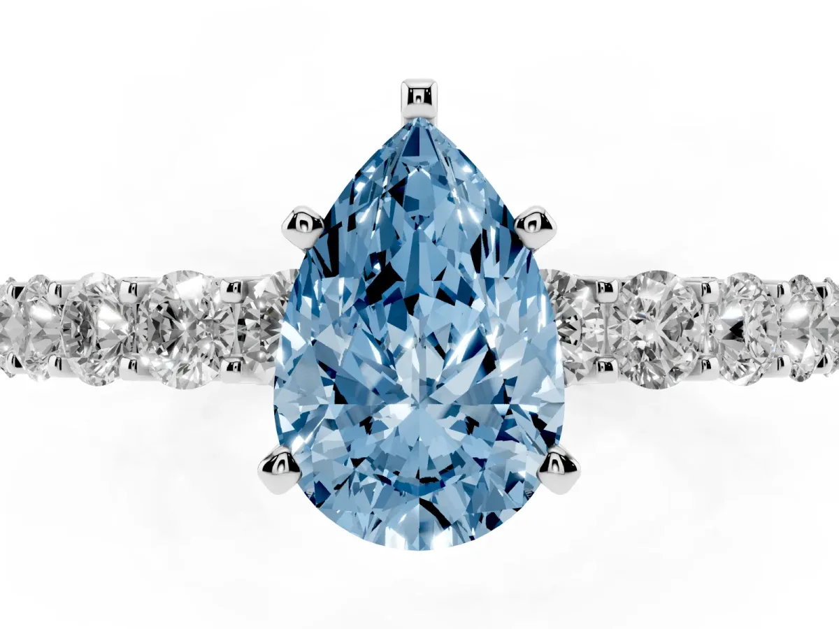 Fancy Blue Pear Cut Diamond Solitaire Ring with Shared Prong Pavé Band and Four-Prong Setting Silver
