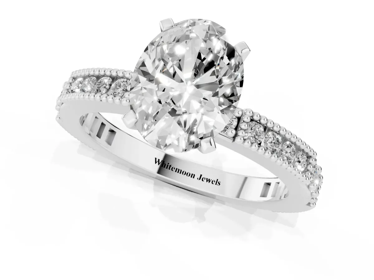 Oval Cut Solitaire with Pavé Band and Four-Prong Setting Platinum