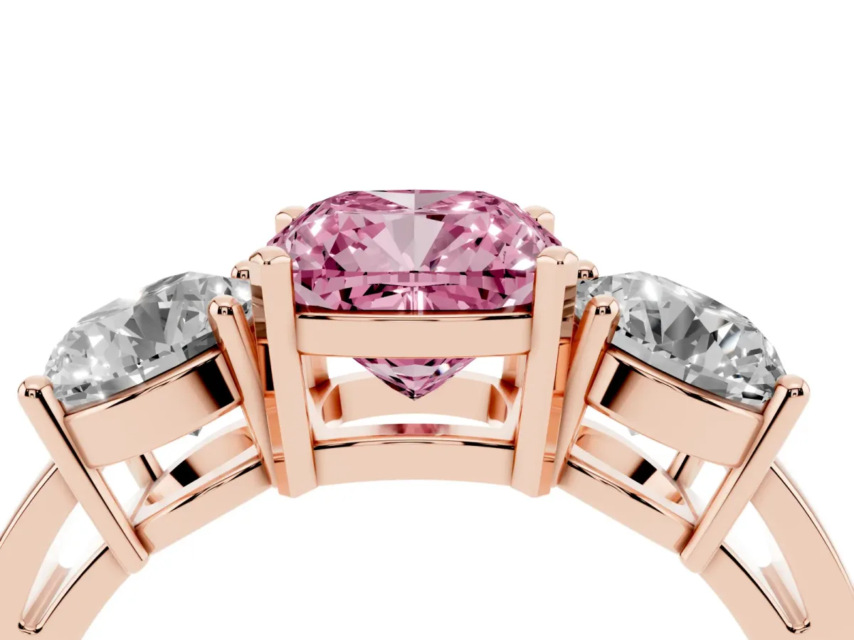 Fancy Pink Three-Stone Cushion Cut Diamond Ring with Round Side Stones, Classic Band, and Four-Prong Setting Rose gold