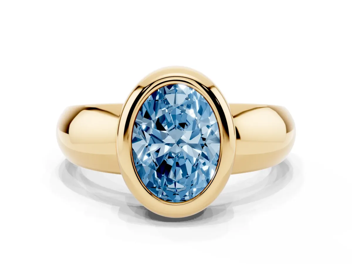 Fancy Blue Bezel Set Oval Cut Solitaire Ring with Wide Band Yellow gold