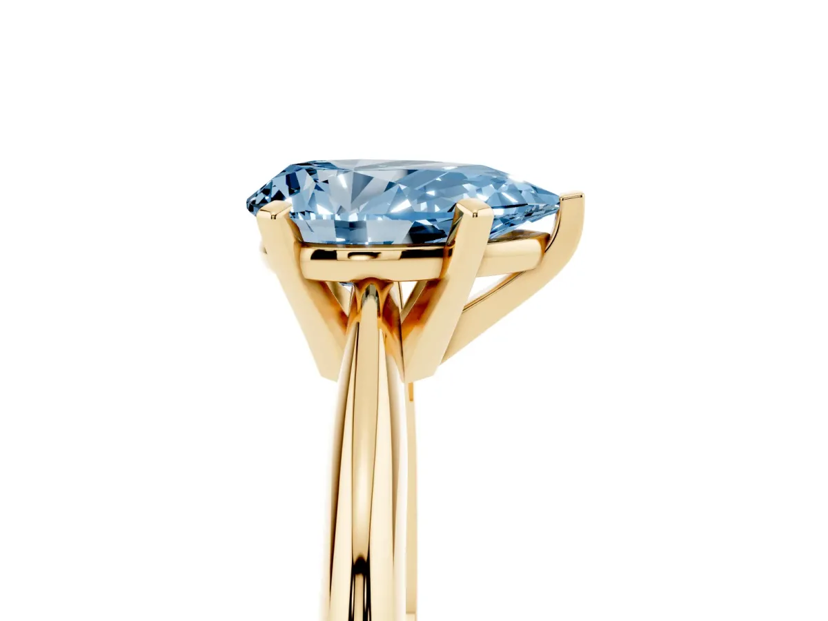 Fancy Blue Pear Cut Cut Solitaire Ring with Four-Prong Setting on a Classic Band Yellow gold